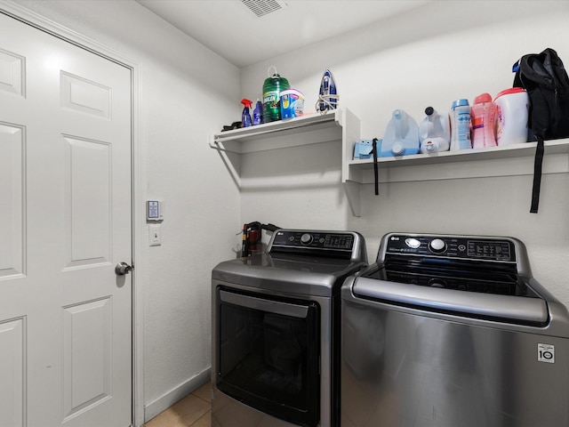 1429 Trading Post Dr, Fort Worth, TX 76131 - laundry area with separate washer and dryer and tile patterned floors