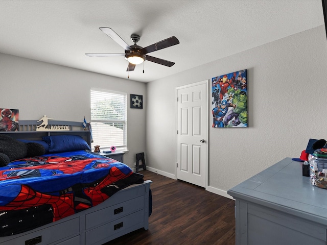 1429 Trading Post Dr, Fort Worth, TX 76131 - bedroom with dark wood-type flooring, baseboards, ceiling fan, and a textured wall