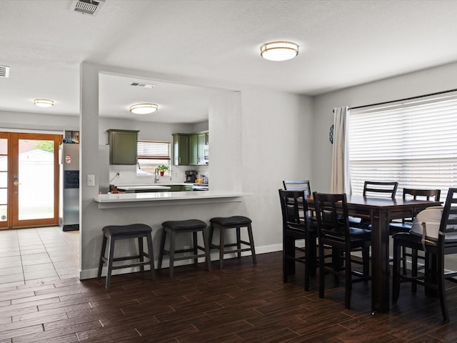 1429 Trading Post Dr, Fort Worth, TX 76131 - dining area featuring dark wood-style flooring, plenty of natural light, and baseboards
