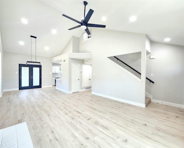 227 Rodeo Dr, Keller, TX 76248 - unfurnished living room featuring stairs, light wood-style floors, ceiling fan, baseboards, and high vaulted ceiling