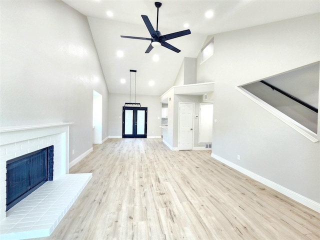 227 Rodeo Dr, Keller, TX 76248 - unfurnished living room featuring high vaulted ceiling, ceiling fan, french doors, light wood-type flooring, and baseboards