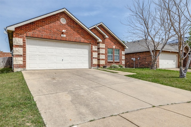 703 Moss Glen Trl, Arlington, TX 76002 - traditional-style house with brick siding, a front yard, driveway, and an attached garage