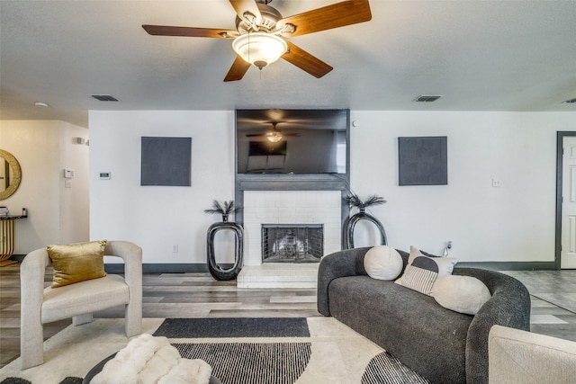 703 Moss Glen Trl, Arlington, TX 76002 - living area with a brick fireplace, a ceiling fan, baseboards, and wood finished floors