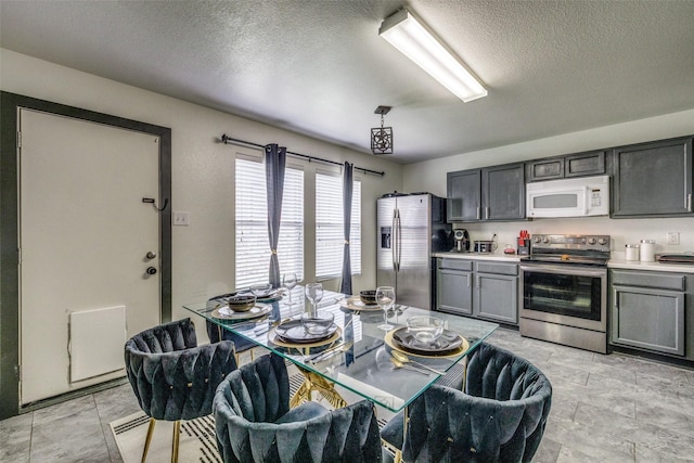 703 Moss Glen Trl, Arlington, TX 76002 - dining space featuring a textured ceiling