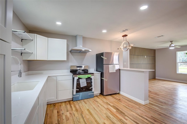 2189 Rs County Road 3150, Emory, TX 75440 - kitchen with appliances with stainless steel finishes, exhaust hood, a sink, light wood finished floors, and white cabinets