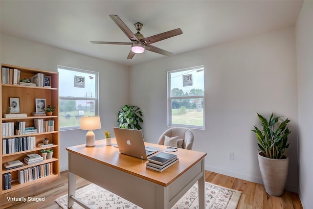 2189 Rs County Road 3150, Emory, TX 75440 - home office featuring ceiling fan, light wood-style flooring, and healthy amount of natural light