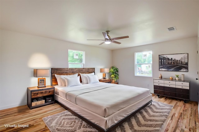 2189 Rs County Road 3150, Emory, TX 75440 - bedroom featuring multiple windows, light wood-style floors, and ceiling fan