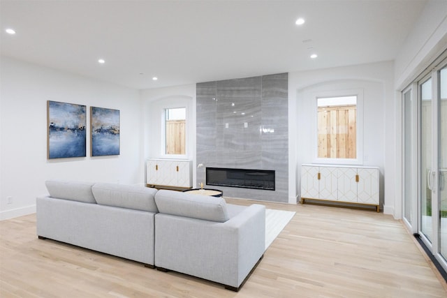 2935 Lovers Ln, University Park, TX 75225 - living area featuring light wood-style flooring, recessed lighting, a large fireplace, and baseboards