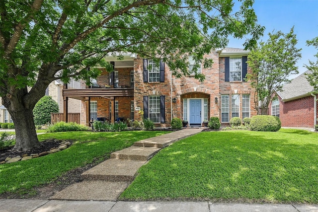 1500 Cool Springs Dr, Allen, TX 75013 - view of front of house featuring a balcony, brick siding, and a front yard