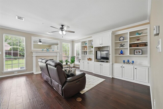 1500 Cool Springs Dr, Allen, TX 75013 - living area with ornamental molding, a ceiling fan, dark wood finished floors, plenty of natural light, and a fireplace