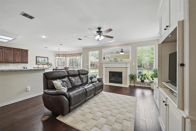 1500 Cool Springs Dr, Allen, TX 75013 - living area featuring dark wood-style flooring, ceiling fan, plenty of natural light, a glass covered fireplace, and recessed lighting