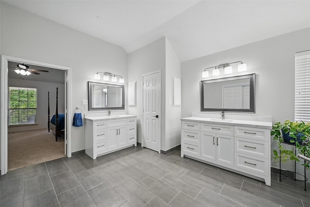 1500 Cool Springs Dr, Allen, TX 75013 - bathroom featuring two vanities, a ceiling fan, baseboards, and vaulted ceiling