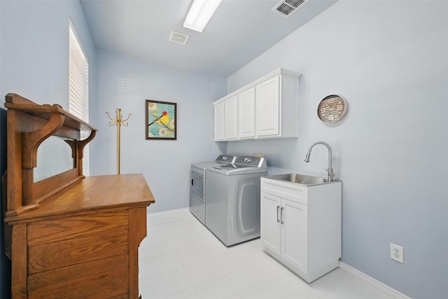 1500 Cool Springs Dr, Allen, TX 75013 - laundry room featuring independent washer and dryer, cabinet space, baseboards, and light floors
