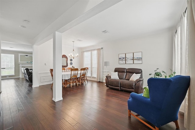 1500 Cool Springs Dr, Allen, TX 75013 - living area with dark wood-style flooring and a chandelier