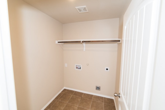 2105 Meadow View Dr, Princeton, TX 75407 - washroom with electric dryer hookup, washer hookup, baseboards, dark tile patterned floors, and gas dryer hookup