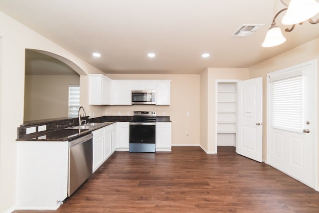 2105 Meadow View Dr, Princeton, TX 75407 - kitchen featuring stainless steel appliances, a sink, dark wood-style floors, white cabinets, and recessed lighting