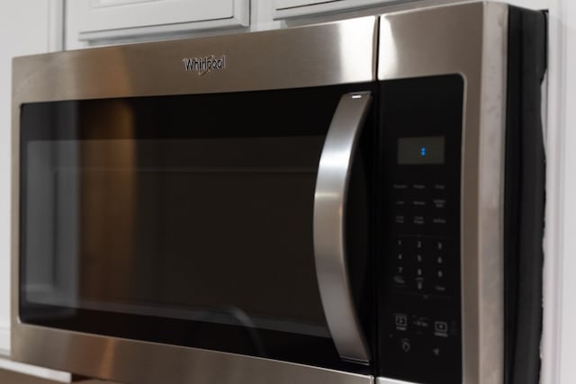 2105 Meadow View Dr, Princeton, TX 75407 - kitchen view of white cabinetry and stainless steel microwave