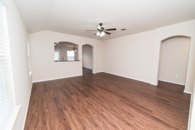 2105 Meadow View Dr, Princeton, TX 75407 - unfurnished room with arched walkways, a ceiling fan, wood finished floors, baseboards, and lofted ceiling