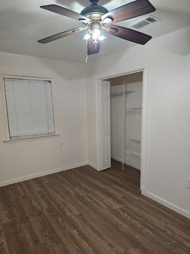 3915 Flory St, North Richland Hills, TX 76180 - unfurnished bedroom featuring dark wood-type flooring, baseboards, a closet, and ceiling fan