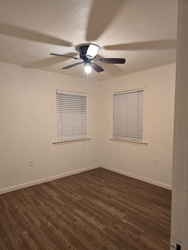 3915 Flory St, North Richland Hills, TX 76180 - spare room with a ceiling fan, dark wood-style floors, a textured ceiling, and baseboards