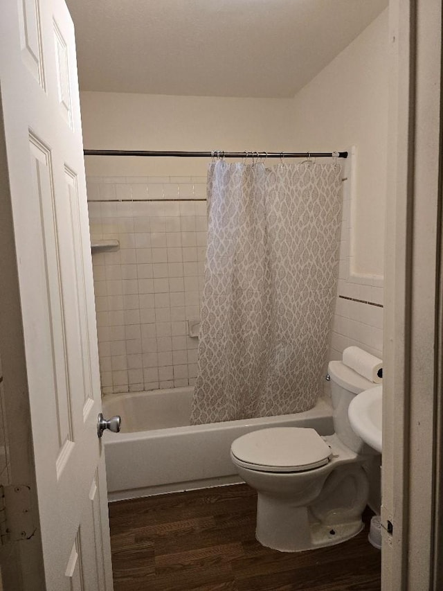 3915 Flory St, North Richland Hills, TX 76180 - full bath with wood finished floors, toilet, and shower / bathtub combination with curtain