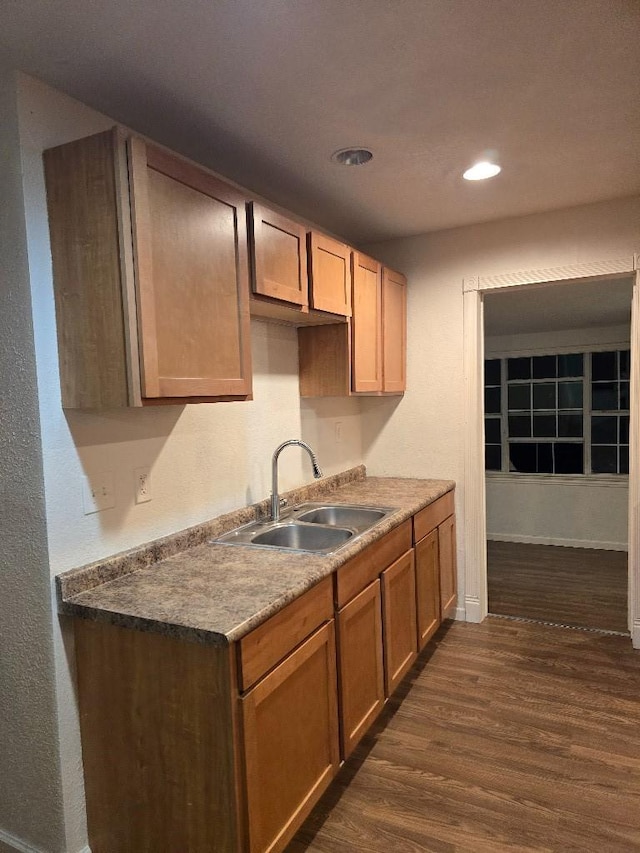 3915 Flory St, North Richland Hills, TX 76180 - kitchen featuring a sink, dark wood-type flooring, recessed lighting, and baseboards