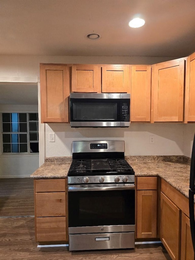 3915 Flory St, North Richland Hills, TX 76180 - kitchen featuring appliances with stainless steel finishes, dark wood-style floors, light countertops, and recessed lighting