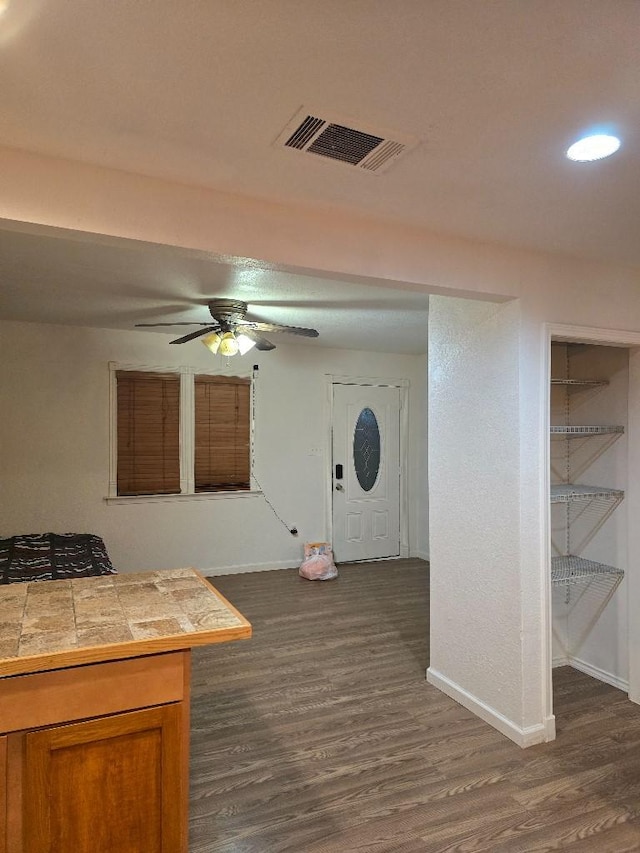 3915 Flory St, North Richland Hills, TX 76180 - entryway featuring dark wood-type flooring, baseboards, a ceiling fan, and recessed lighting