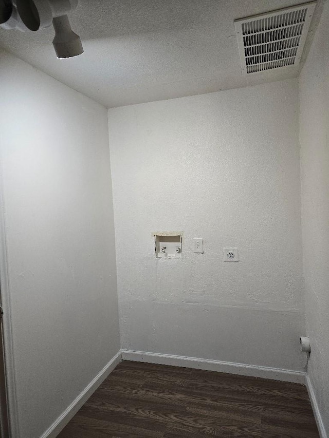 3915 Flory St, North Richland Hills, TX 76180 - laundry room with electric dryer hookup, hookup for a washing machine, dark wood-type flooring, and baseboards