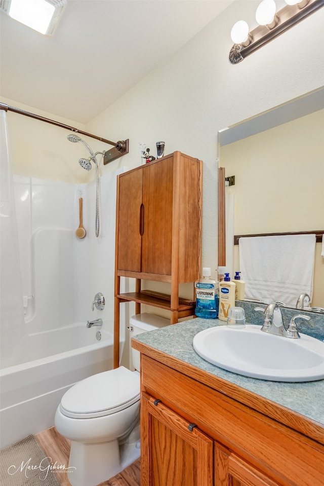 1170 163rd Hwy, Benton, LA 71006 - bathroom featuring vanity, washtub / shower combination, toilet, and wood finished floors