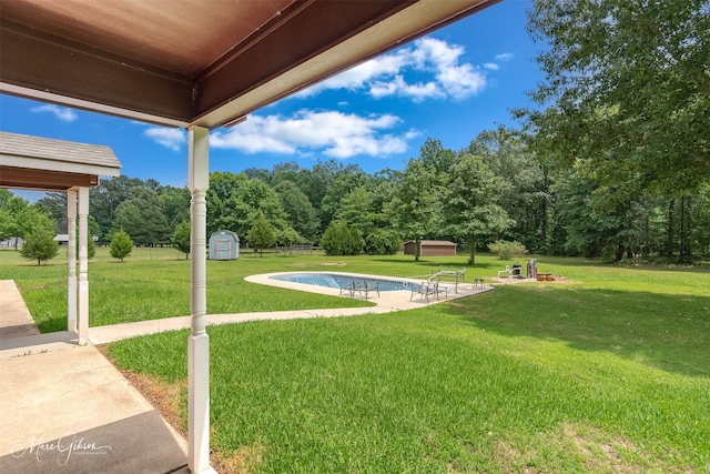 1170 163rd Hwy, Benton, LA 71006 - view of green lawn with an outdoor pool and a patio area