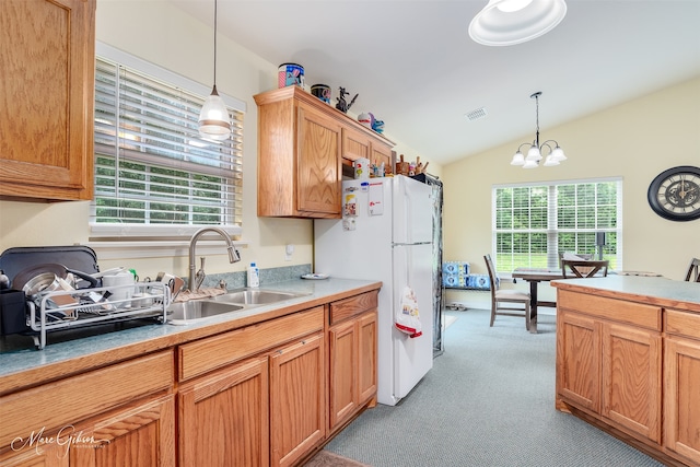 1170 163rd Hwy, Benton, LA 71006 - kitchen featuring a sink, freestanding refrigerator, light colored carpet, lofted ceiling, and pendant lighting