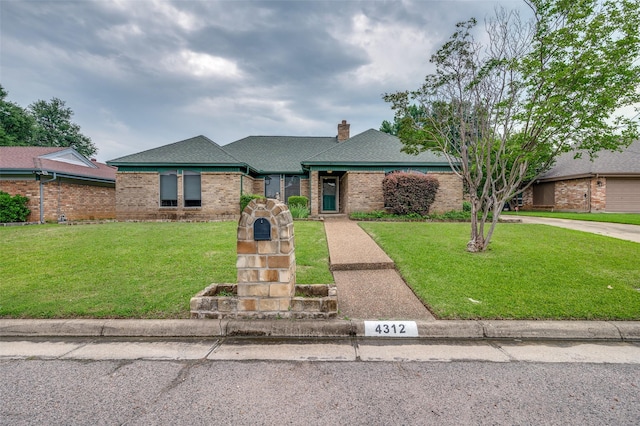 4312 High Spgs, Arlington, TX 76016 - view of front of home featuring brick siding, a front lawn, a chimney, and roof with shingles