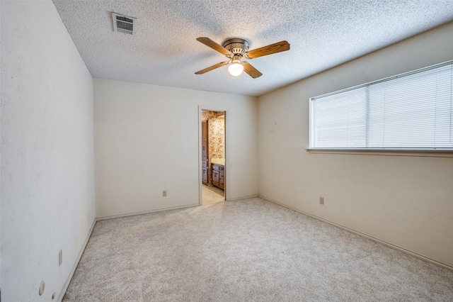4312 High Spgs, Arlington, TX 76016 - empty room featuring a ceiling fan, a textured ceiling, carpet, and baseboards