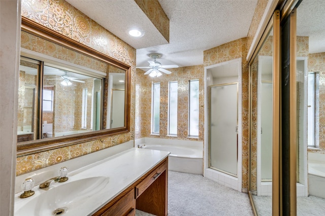 4312 High Spgs, Arlington, TX 76016 - bathroom with wallpapered walls, a textured ceiling, a ceiling fan, a shower stall, and a garden tub