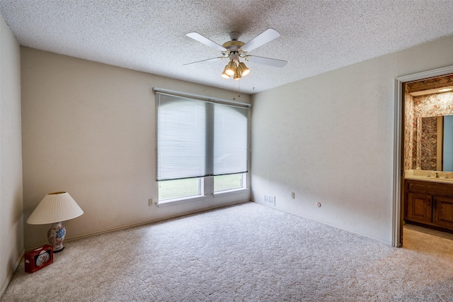4312 High Spgs, Arlington, TX 76016 - carpeted empty room with a textured ceiling, ceiling fan, and a sink