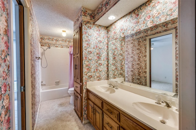 4312 High Spgs, Arlington, TX 76016 - bathroom featuring a textured ceiling, wallpapered walls, double vanity, toilet, and tub / shower combination