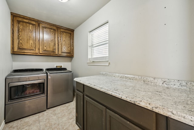 1003 N Washburn St, Decatur, TX 76234 - laundry room with cabinet space and washer and clothes dryer