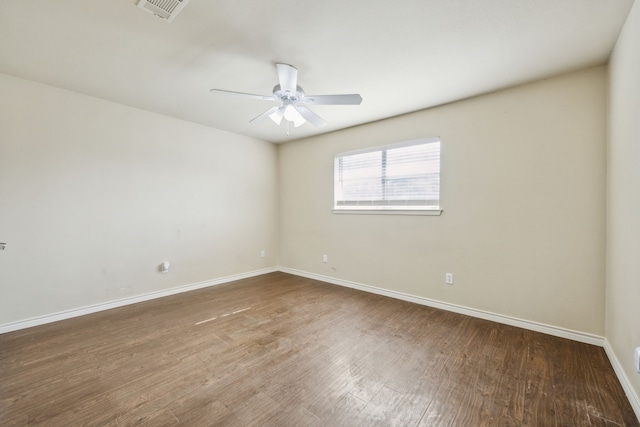 1003 N Washburn St, Decatur, TX 76234 - empty room with ceiling fan, wood finished floors, and baseboards