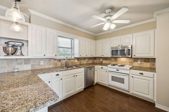 1003 N Washburn St, Decatur, TX 76234 - kitchen featuring appliances with stainless steel finishes, a sink, dark wood-type flooring, ceiling fan, and decorative backsplash