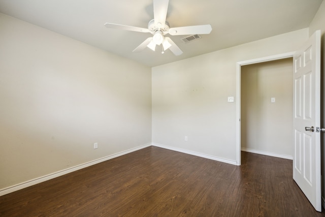 1003 N Washburn St, Decatur, TX 76234 - empty room featuring ceiling fan, dark wood-type flooring, and baseboards