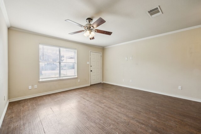 1003 N Washburn St, Decatur, TX 76234 - spare room featuring crown molding, a ceiling fan, dark wood-style floors, and baseboards