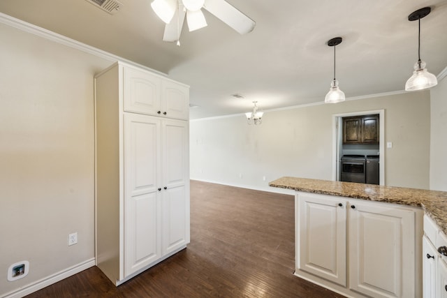 1003 N Washburn St, Decatur, TX 76234 - kitchen with washer and clothes dryer, white cabinetry, dark wood-style flooring, ceiling fan, and crown molding