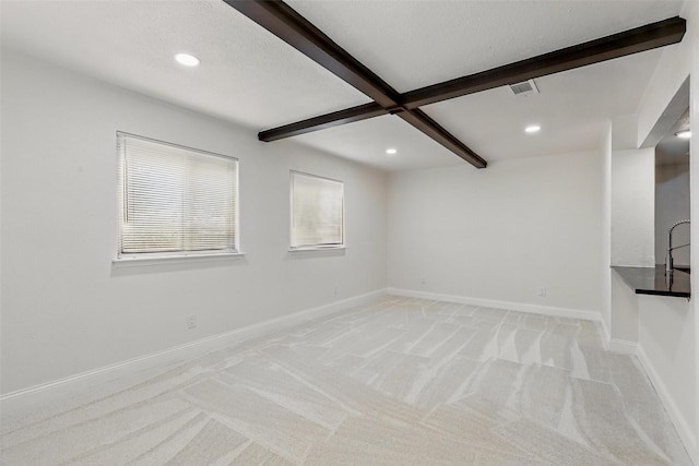 513 Edna Ct, Everman, TX 76140 - unfurnished living room featuring light colored carpet, beamed ceiling, recessed lighting, and baseboards