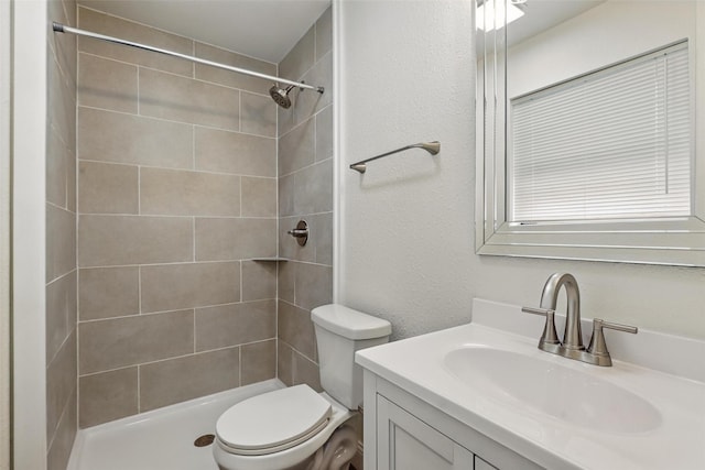 513 Edna Ct, Everman, TX 76140 - bathroom with toilet, vanity, and tiled shower