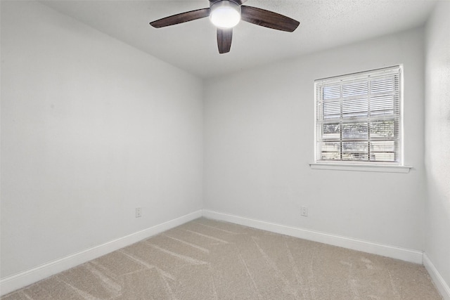 513 Edna Ct, Everman, TX 76140 - empty room with baseboards, light carpet, and a ceiling fan