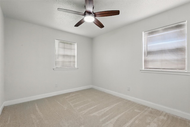 513 Edna Ct, Everman, TX 76140 - unfurnished room featuring baseboards, light carpet, a ceiling fan, and a textured ceiling