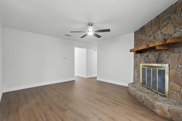 513 Edna Ct, Everman, TX 76140 - unfurnished living room featuring ceiling fan, wood finished floors, baseboards, and a fireplace