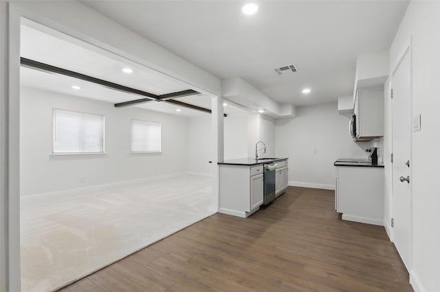 513 Edna Ct, Everman, TX 76140 - kitchen featuring appliances with stainless steel finishes, dark countertops, recessed lighting, open floor plan, and dark wood finished floors