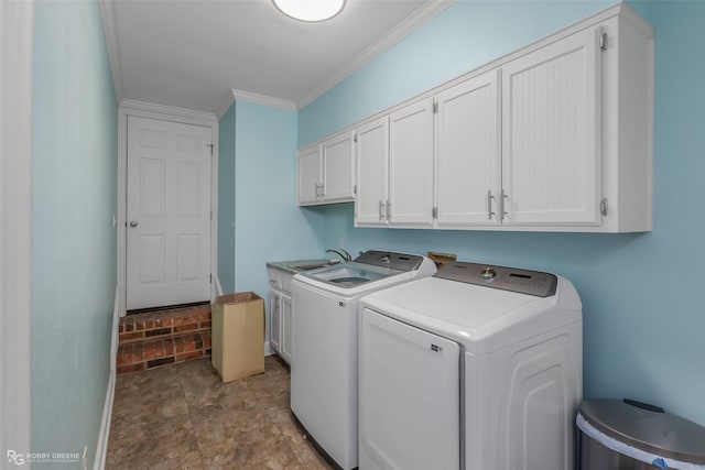 clothes washing area with cabinet space, washing machine and clothes dryer, crown molding, baseboards, and stone finish floors